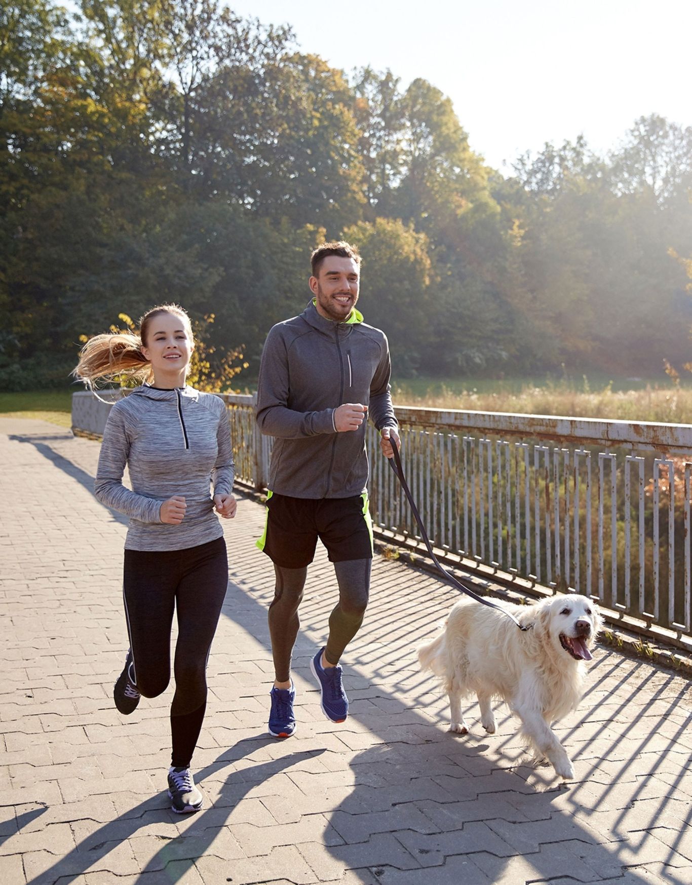 Provost couple jogging dog